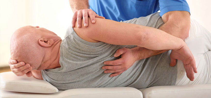 Patient receiving Chiropractic Care in ' . $businessCity . ' for pain relief